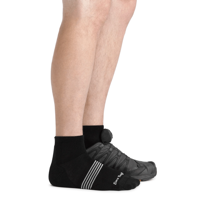 Load image into Gallery viewer, Black ankle socks worn with a black sneaker on a white background