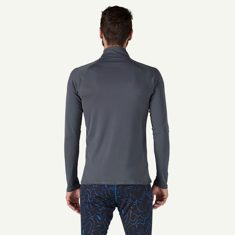 Load image into Gallery viewer, Person wearing a gray long-sleeve athletic shirt and patterned leggings on a white background