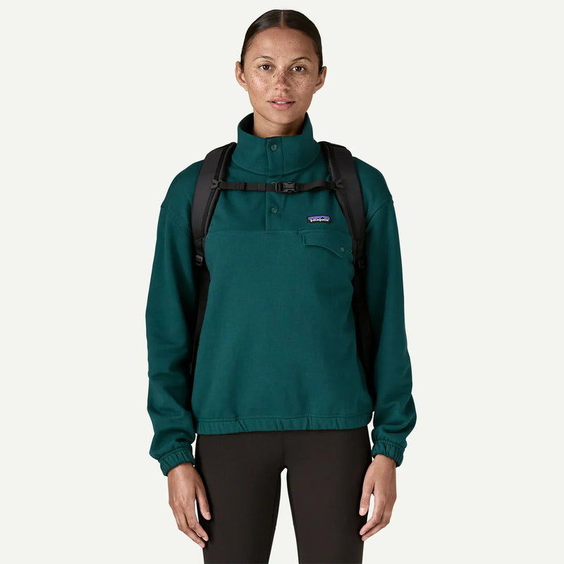Load image into Gallery viewer, Person wearing black backpack straps and a buckle across the chest on a white background