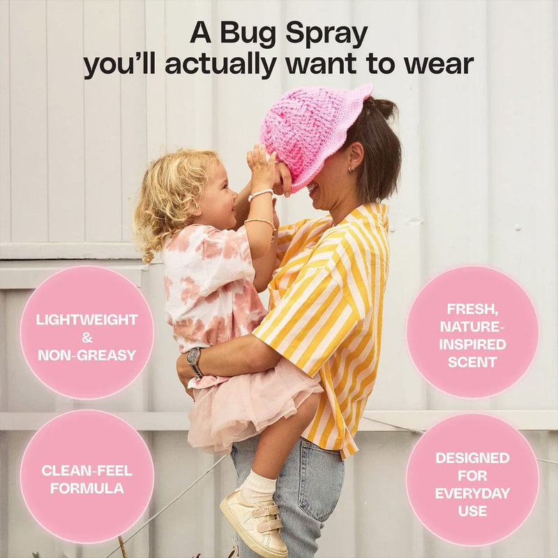 Load image into Gallery viewer, Woman holding a child with a pink hat, surrounded by text about a bug spray.
