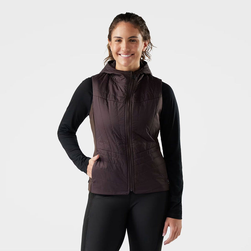 Load image into Gallery viewer, Woman wearing a brown quilted vest over a black long-sleeve shirt on a white background