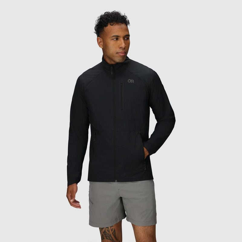 Load image into Gallery viewer, Man wearing a black jacket and gray shorts on a light gray background