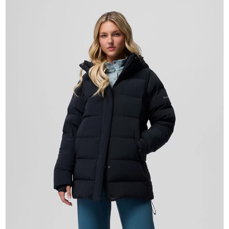 Load image into Gallery viewer, Woman wearing a black puffer jacket on a light gray background