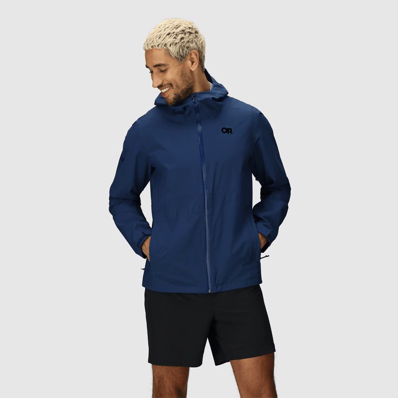 Load image into Gallery viewer, Man wearing a blue jacket with a hood on a gray background