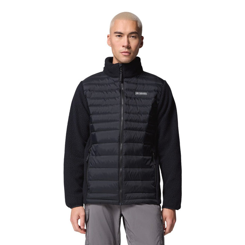 Load image into Gallery viewer, Person wearing a black puffer vest on a white background