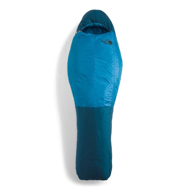 Load image into Gallery viewer, Blue sleeping bag with The North Face logo on a white background