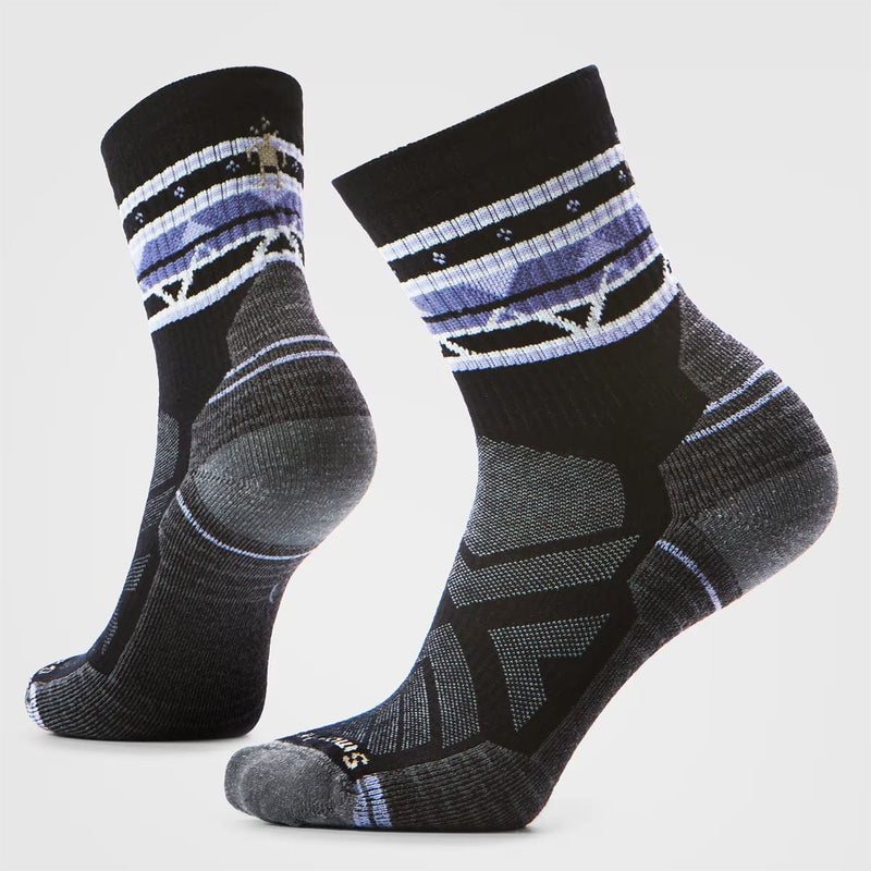 Load image into Gallery viewer, Pair of black and gray patterned socks on a light gray background