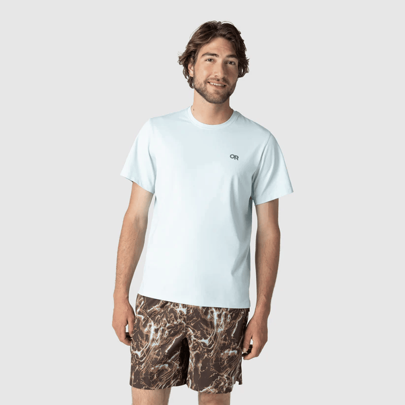 Load image into Gallery viewer, Man wearing a light blue t-shirt and camouflage shorts on a white background