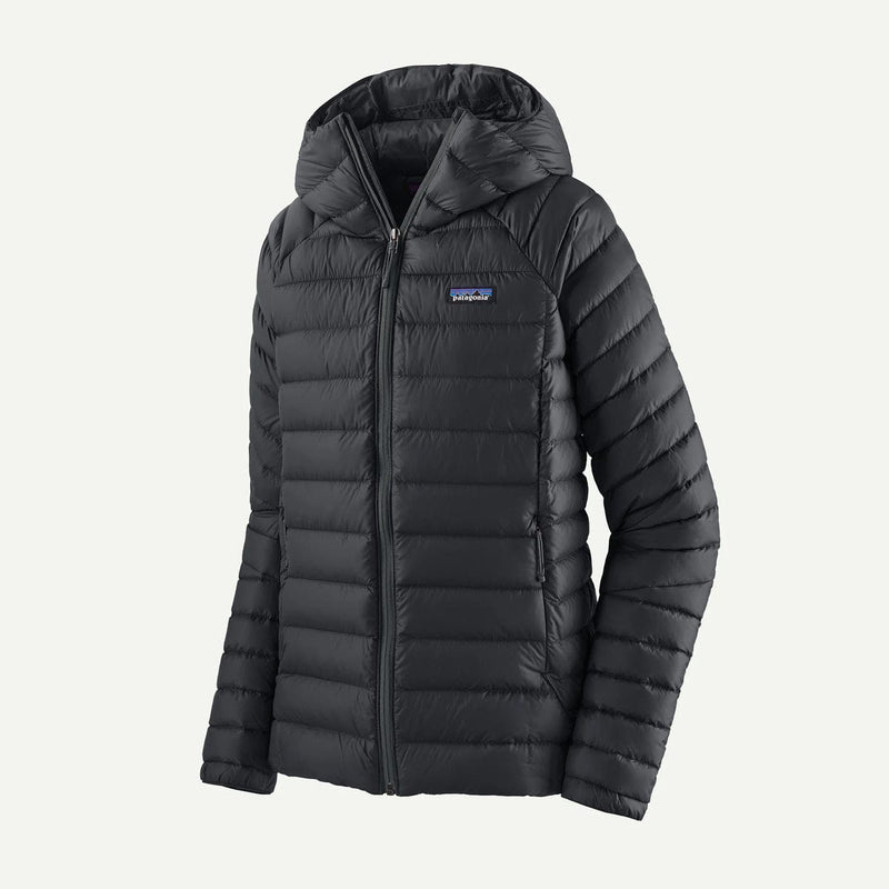 Load image into Gallery viewer, Black puffer jacket with a brand logo on a light gray background