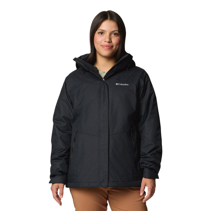 Load image into Gallery viewer, Woman wearing a black Columbia jacket on a white background