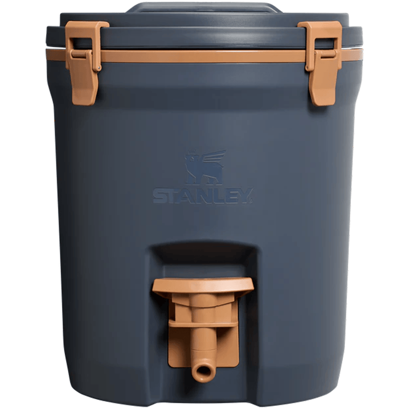 Load image into Gallery viewer, Blue cooler with brown handles and a visible Stanley logo on a white background