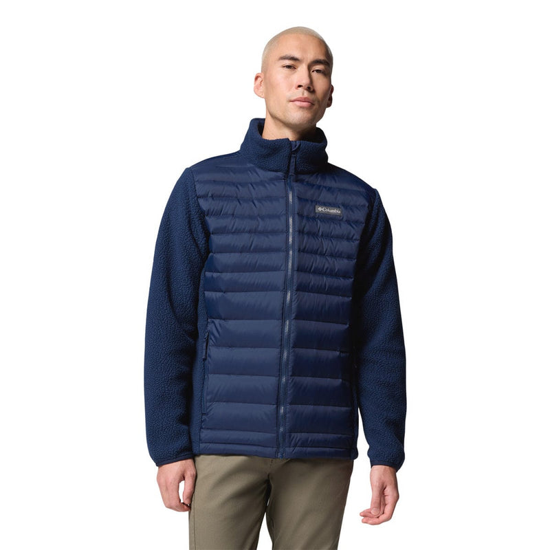 Load image into Gallery viewer, Man wearing a blue puffer jacket on a white background