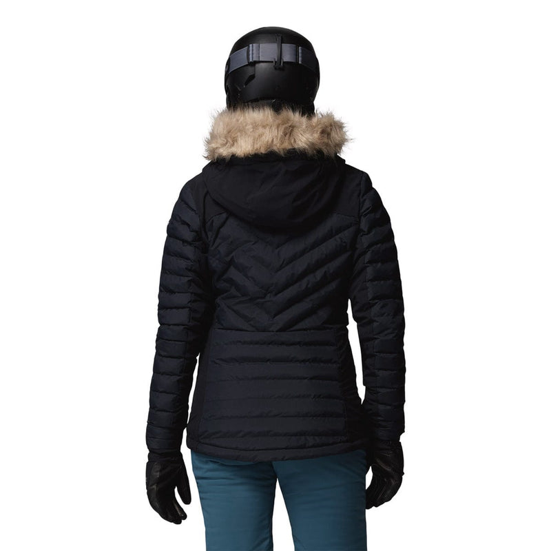 Load image into Gallery viewer, Person wearing a black puffer jacket with fur hood on a white background