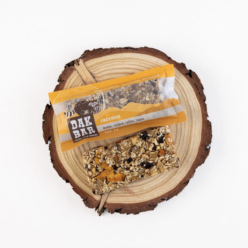 Load image into Gallery viewer, Dak Bar snack on a wooden log with a white background