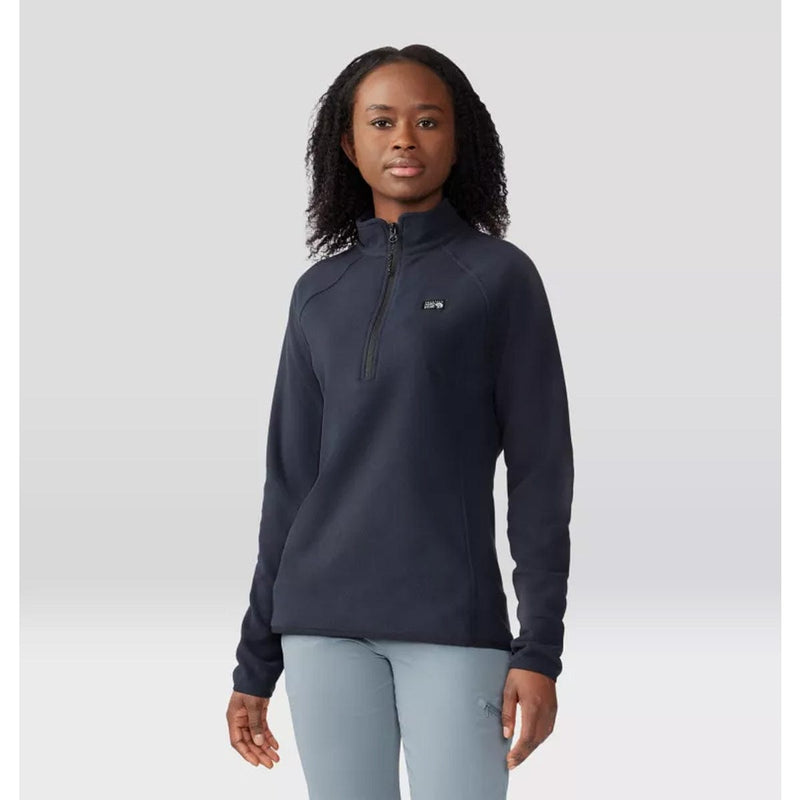 Load image into Gallery viewer, Person wearing a navy blue pullover with a brand logo on a light gray background