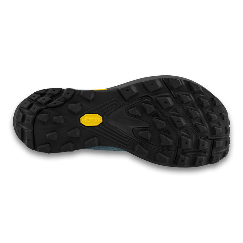 Load image into Gallery viewer, Close-up of a black shoe sole with a yellow brand logo on a white background