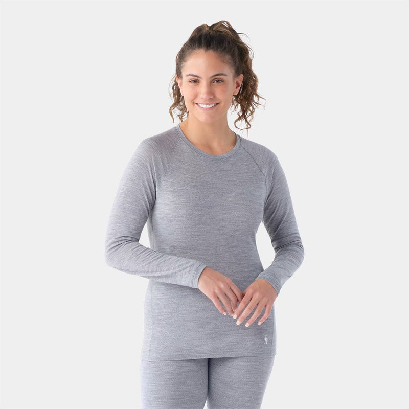 Load image into Gallery viewer, Woman wearing a gray long-sleeve athletic shirt on a white background