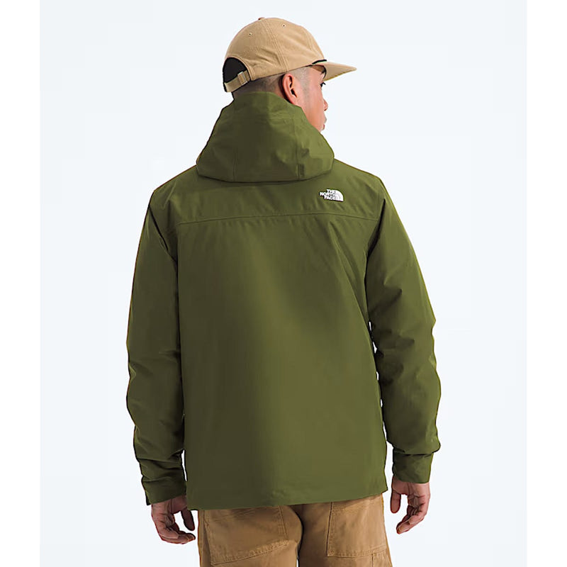 Load image into Gallery viewer, Person wearing a green jacket with a visible brand logo on the back, standing against a white background.