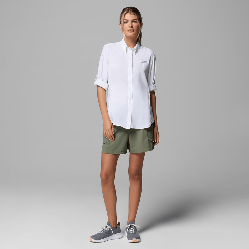 Load image into Gallery viewer, Woman wearing a white shirt and olive green shorts on a light gray background