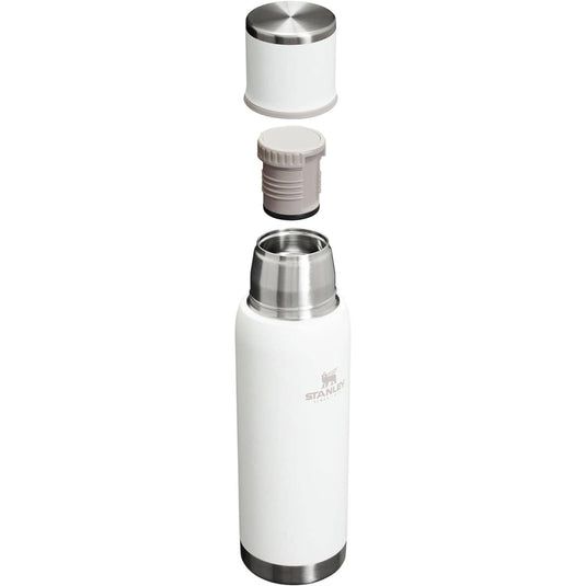 White thermos bottle with silver cap on a white background