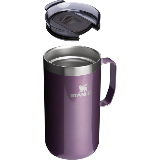 Purple Stanley travel mug with a black lid on a white background