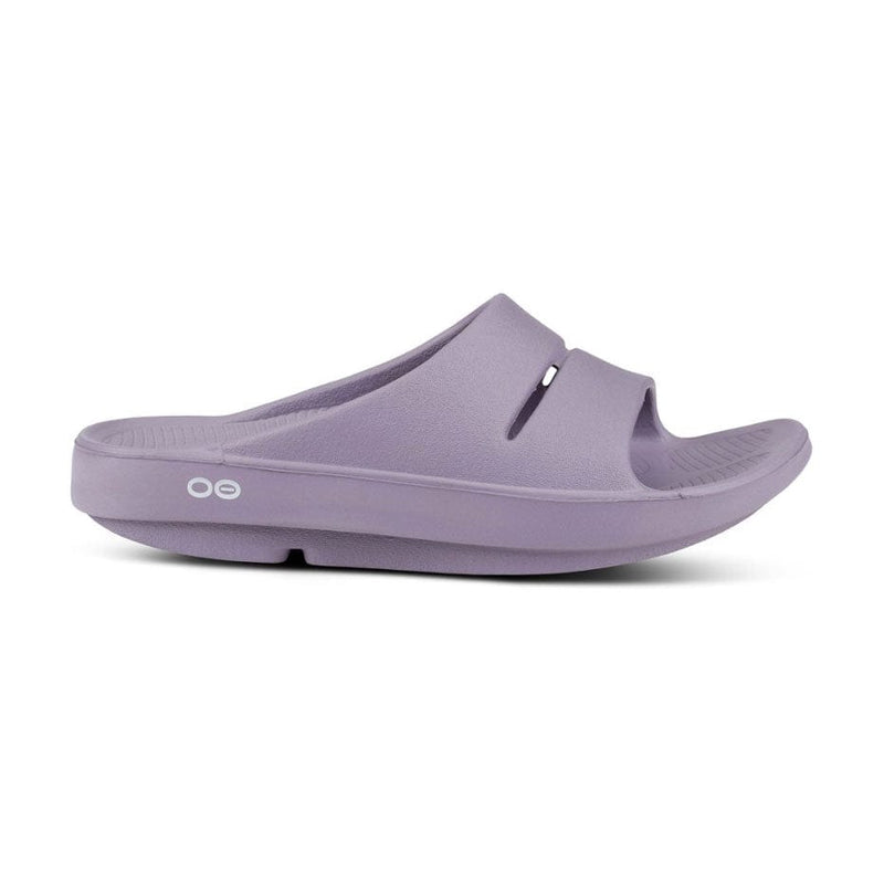 Load image into Gallery viewer, Oofos OOahh Slide sandal with a slip-on design, featuring the brand's logo on the strap.
