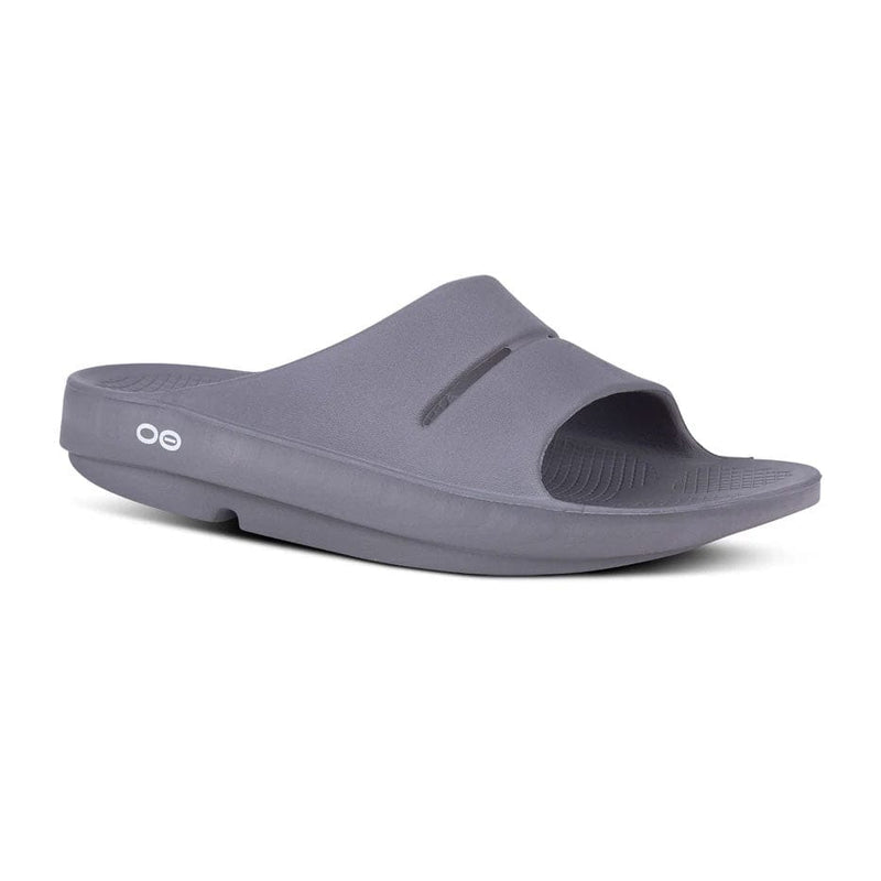 Load image into Gallery viewer, Oofos OOahh Slide sandal with a slip-on design, featuring the brand's logo on the strap.
