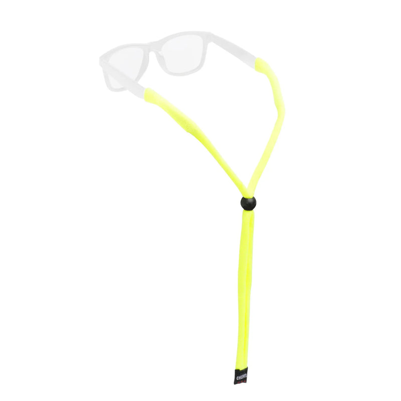 Load image into Gallery viewer, A neon yellow sunglasses strap with a black adjustment slider, shown on a white background with a faint overlay of white sunglasses.
