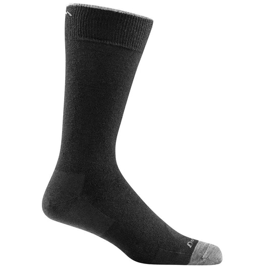 A pair of black Darn Tough crew socks designed for men, showing the side profile of the socks with the brand logo visible.