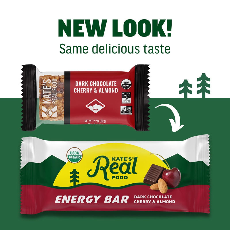 Load image into Gallery viewer, Two versions of Kate's Real Food energy bar packaging with a green background and trees.
