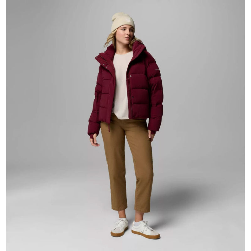 Load image into Gallery viewer, Person wearing a burgundy puffer jacket, beige beanie, white shirt, brown pants, and white sneakers on a gray background

