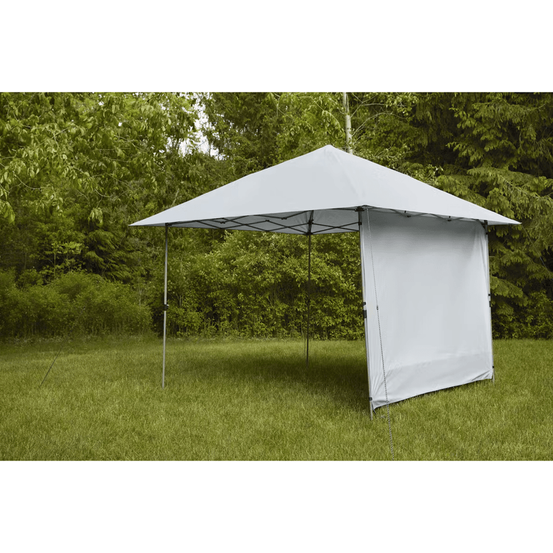 Load image into Gallery viewer, Outdoor canopy tent with side panel in a grassy area with trees
