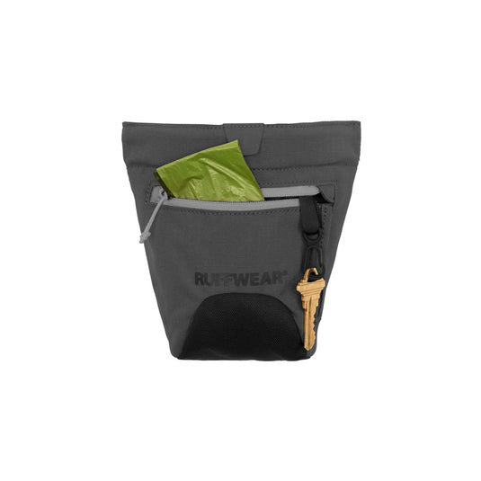 Gray pouch with a key and green item on a white background