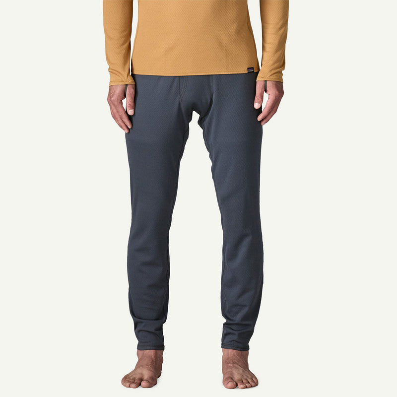 Load image into Gallery viewer, Person wearing navy pants and a mustard yellow long-sleeve shirt on a white background
