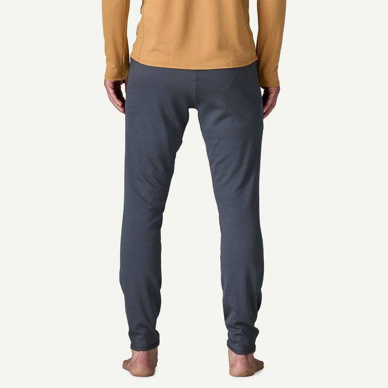 Load image into Gallery viewer, Person wearing mustard yellow long-sleeve top and dark gray jogger pants on a white background
