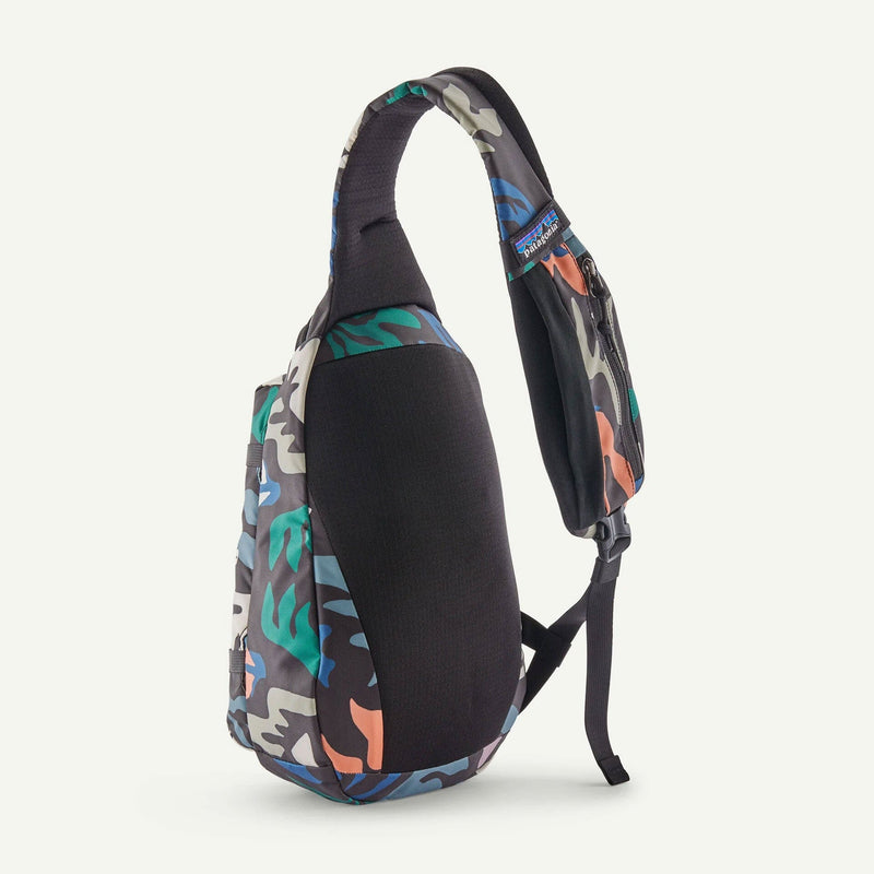 Load image into Gallery viewer, Patagonia back of the Sling Bag with colorful banner
