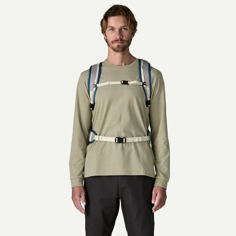 Load image into Gallery viewer, Man wearing a bag on his back with two shoulder straps, a strap across his chest and another across his wais
