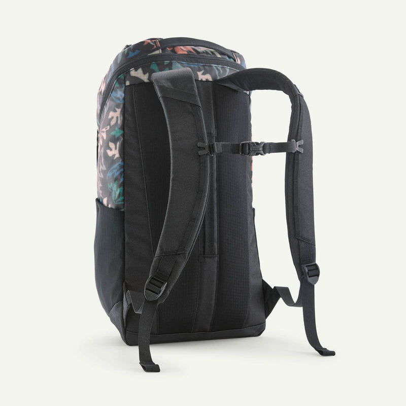 Load image into Gallery viewer, Black backpack with floral pattern on the back on a white background
