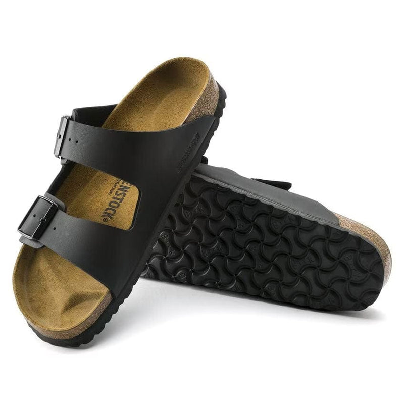 Load image into Gallery viewer, Black sandals with brown soles on a white background
