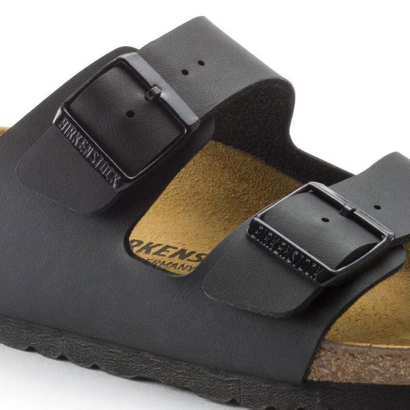 Load image into Gallery viewer, Black Birkenstock sandals with a buckle on a white background
