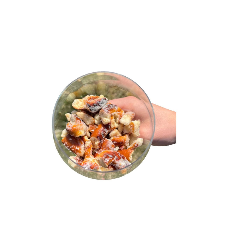 Load image into Gallery viewer, Hand holding a transparent container filled with pretzel bites on a white background
