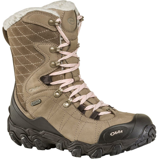 Brown winter boot with pink laces on a white background
