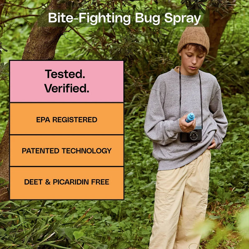Load image into Gallery viewer, Person holding a bottle of bug spray in a forest setting with text about the product's features.
