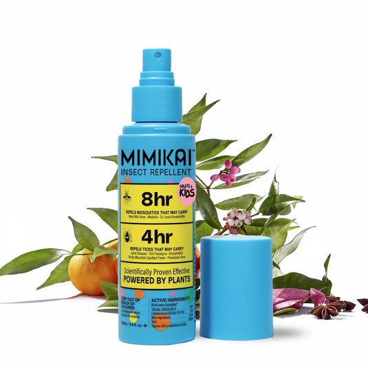 Mimikai insect repellent spray bottle with leaves and flowers on a white background