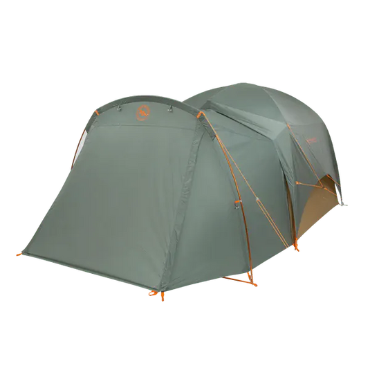 Green camping tent with orange accents on a white background