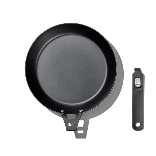 Black frying pan with a handle on a white background