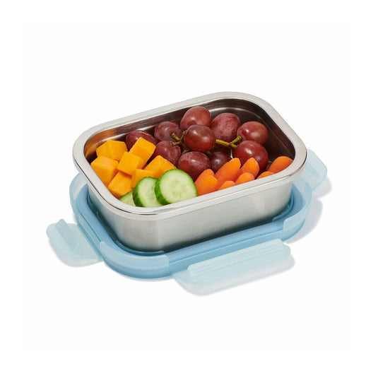 Stainless steel lunch box with fruits and vegetables on a white background