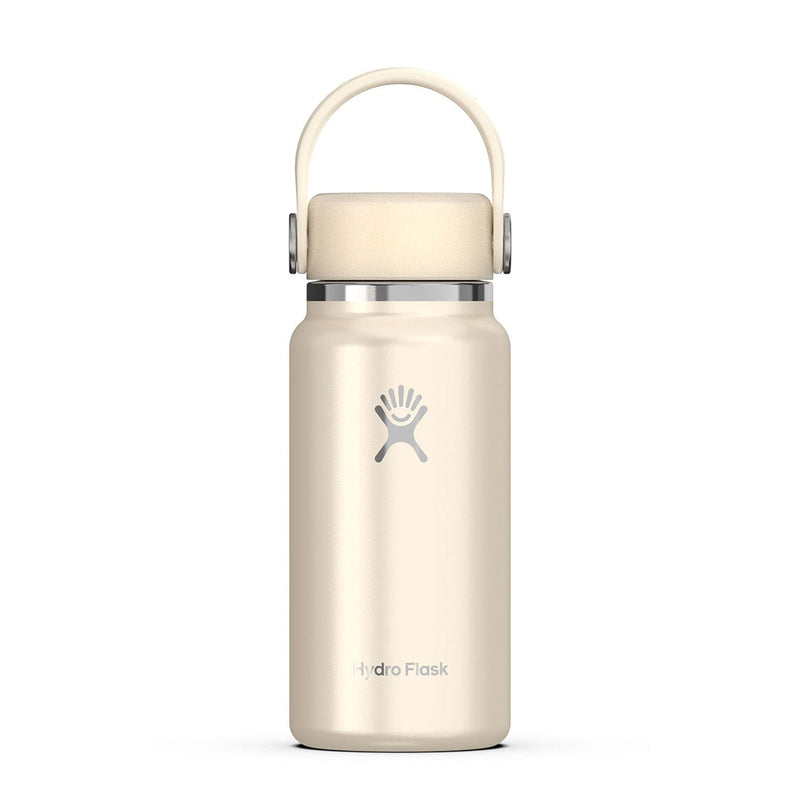 Load image into Gallery viewer, Beige Hydro Flask water bottle with a silver lid on a white background
