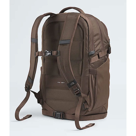 Brown backpack with multiple straps on a light gray background