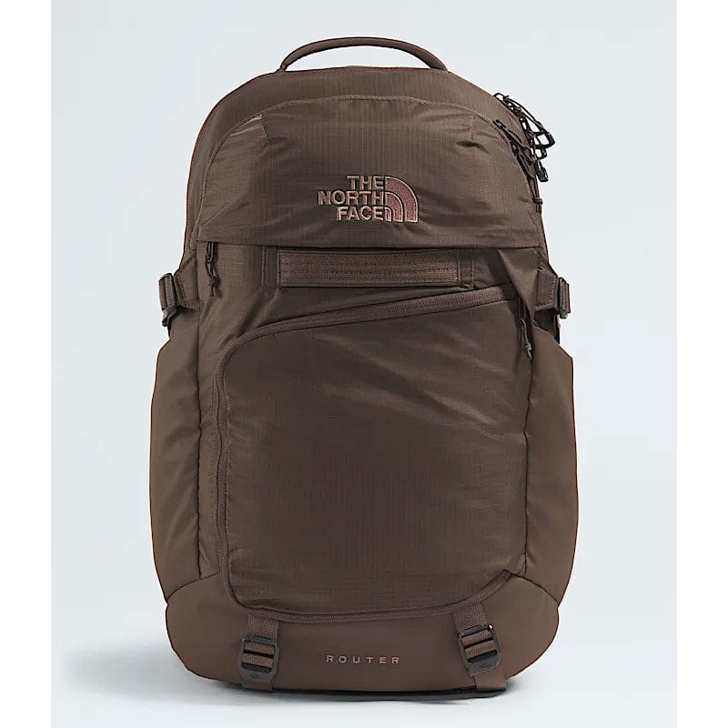 Load image into Gallery viewer, Brown backpack with The North Face logo on a light gray background
